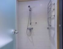 a close up of a shower in a small room